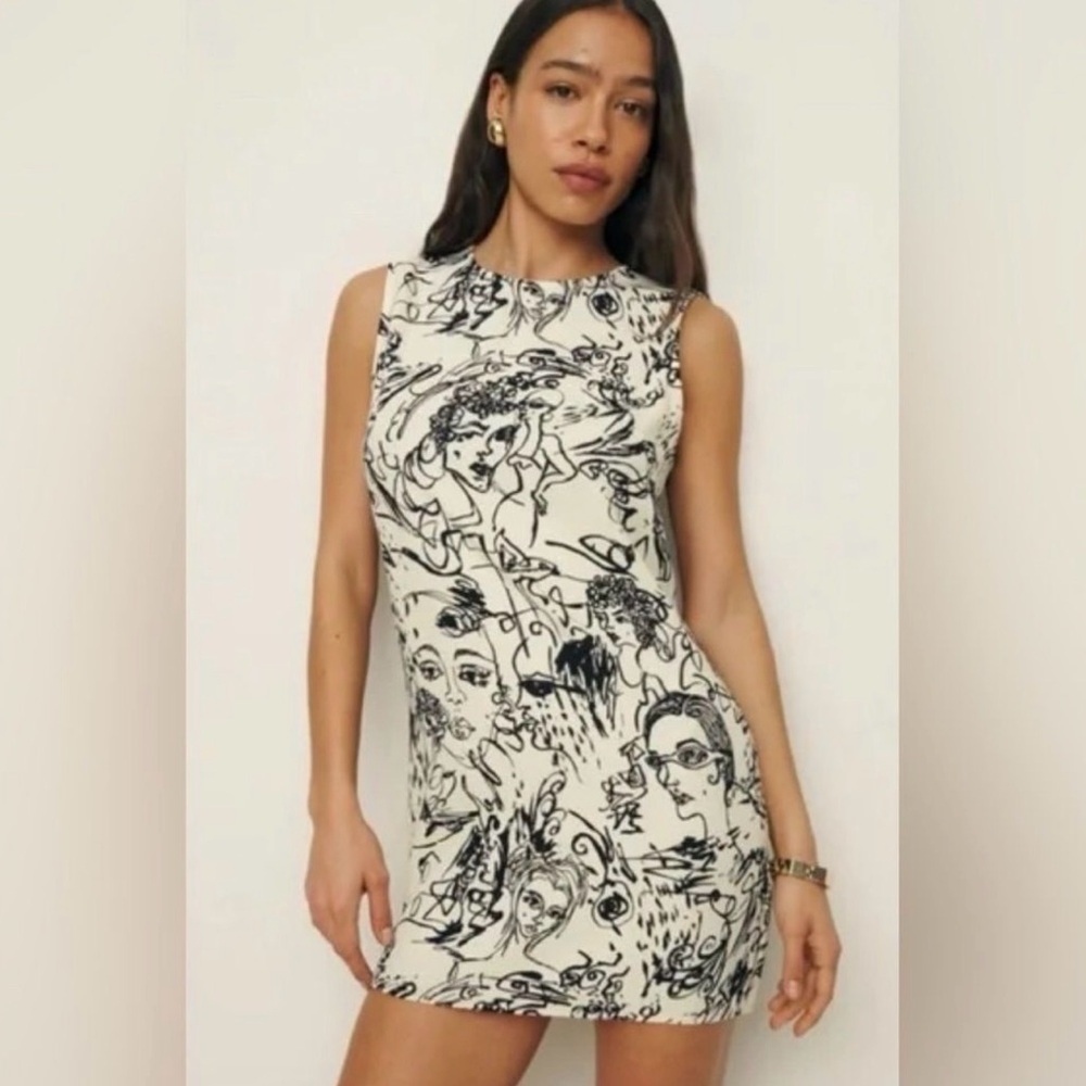Reformation mini dress with faces worn once. no longer made